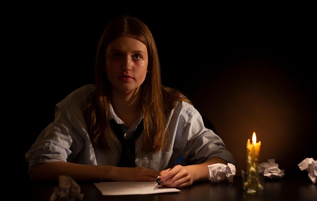 woman writing questions for savings plan consultation